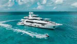 Benetti yacht Emina sailing across crystal clear turquoise waters