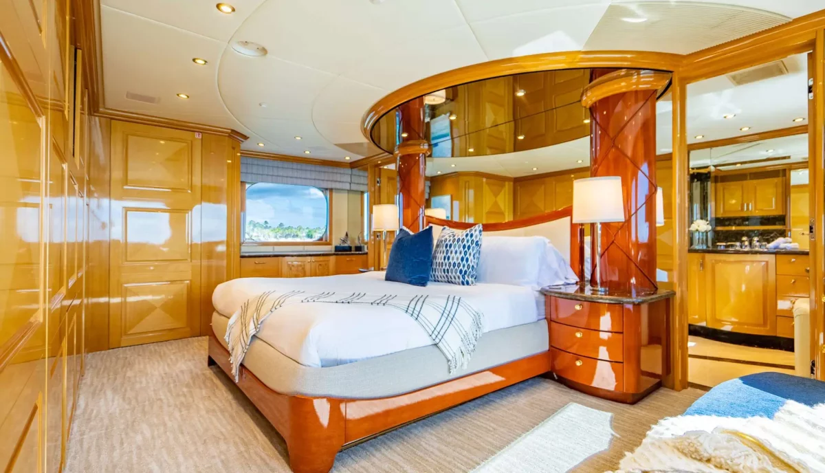 Luxurious primary suite on Reflections Motor Yacht with a king-size bed.