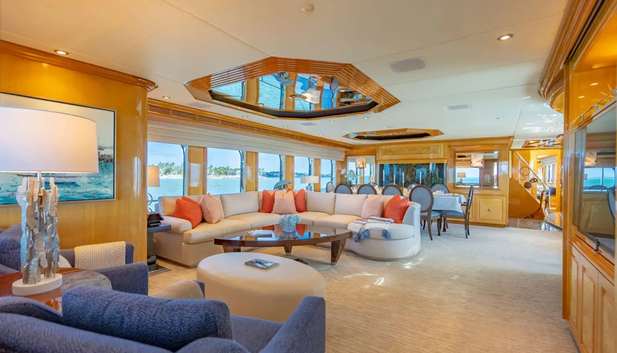Spacious main salon aboard Reflections Motor Yacht with plush seating and ocean views.