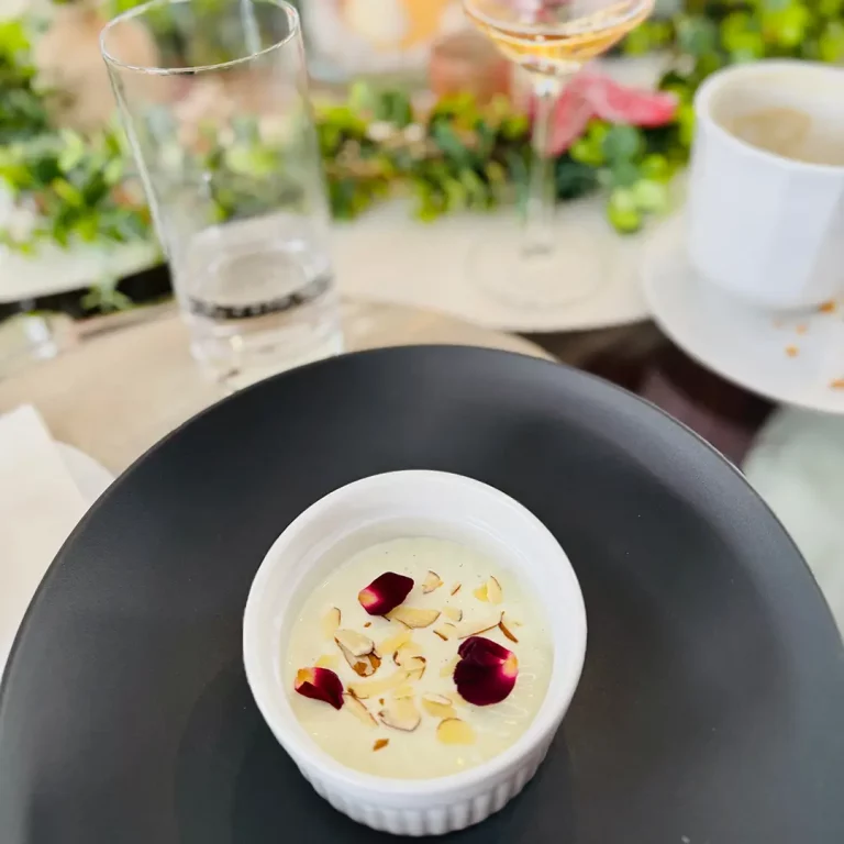 Vanilla dessert with almonds and flower petals on ALLORA yacht