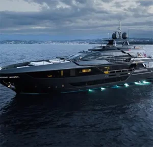 Lady First motor yacht at dusk with underwater lights in the Bahamas
