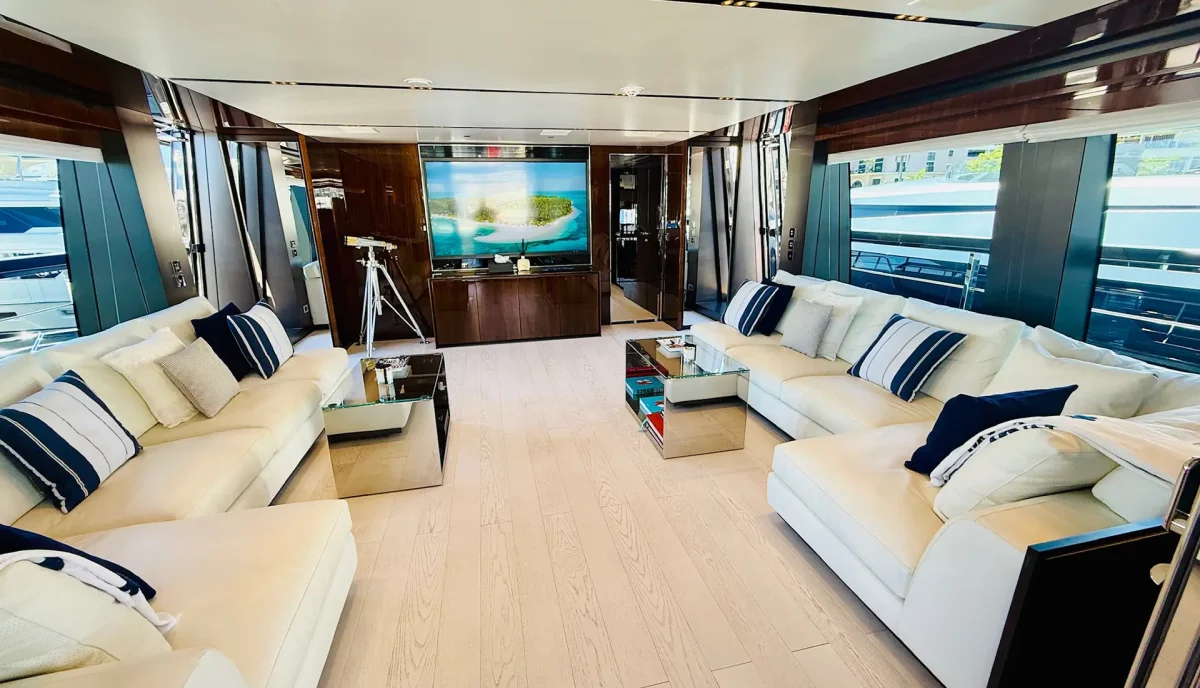 Lady First yacht skylounge with twin sofas and large TV screen