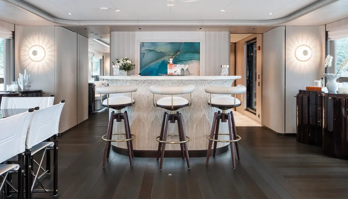 Interior bar area of M yacht with artistic decor and luxury finishes