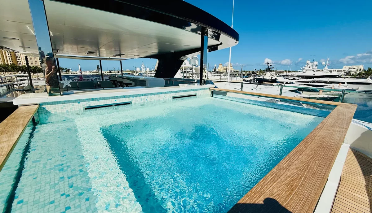 Raised jacuzzi on M yacht sundeck with views of marina
