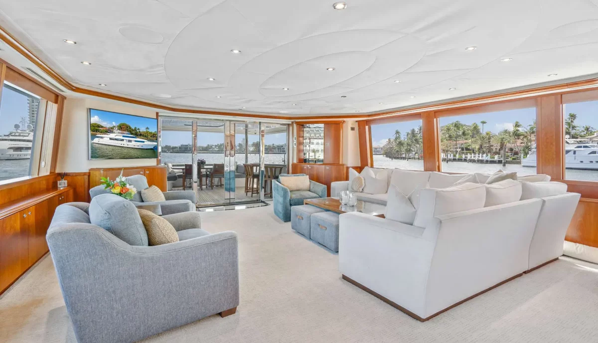 Lounge area with plush sofas and wide windows aboard Sleepover yacht