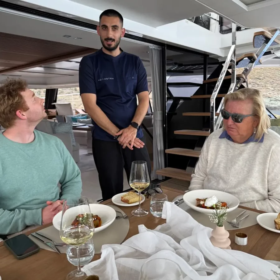 Chef Panos presenting dishes to guests aboard Ad Astra