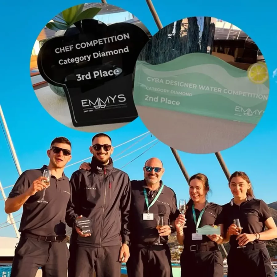 Ad Astra crew toasting with awards in hand at the 2025 EMMYS yacht show in Poros
