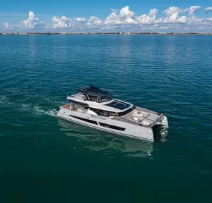 Aerial view of Christal Mio 80 catamaran cruising in calm blue waters
