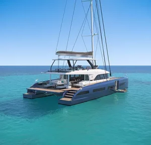 Aft view of IMLADRIS luxury catamaran with spacious lounge and dining areas.