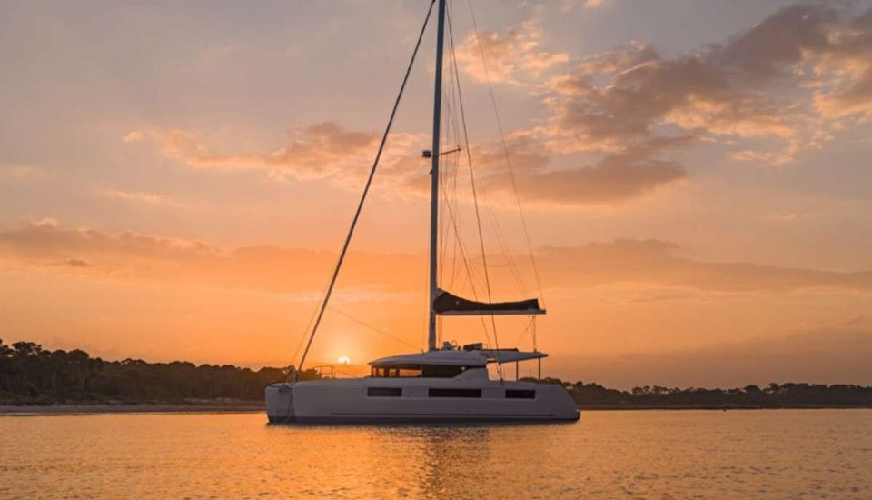 Andare Avanti Sailing Catamaran at Dusk
