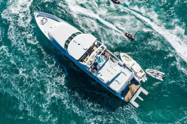 Aerial View of Reflections Motor Yacht & Water Toys Aerial shot of Reflections Motor Yacht with tenders and jet skis in the water.